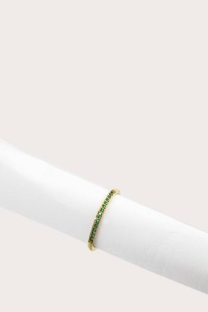 Smulkus aukso spalvos žiedas su žaliais cirkoniais